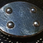 Kambula belt: Oval stainless steel buckle with hammered and polished Sea of Tranquility finish